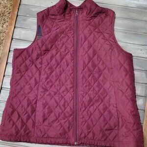 The Women's Plus size Lee Riders 1x Purple Quilted Vest is a stylish and functio